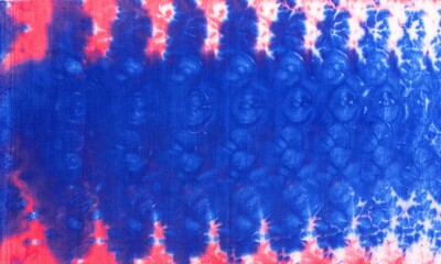 tie dye ancient resist-dyeing techniques Indigo blue red textile pattern abstract background on cotton fabric simple motifs, monochromatic color schemes, fashionable garments