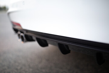 Rear bumper skirt and diffuser with ribs