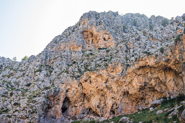 Sunny day over the rocks and the blue water in Sa Calobra, Palma de Mallorca, Balearic Islands, Spain