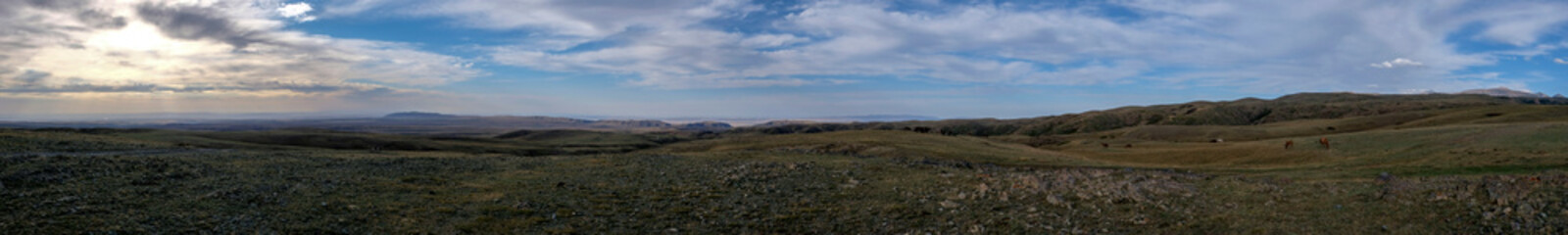 Colorful hills landscape in evening time with clouds background.