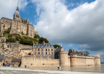 Obraz premium Le Mont Saint-Michel, medieval fortified abbey and village on a tidal island in the Normandy, France, at low tide