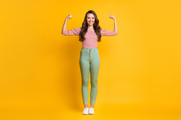 Full length body size photo of girl showing strong biceps with long hair smiling with hands...
