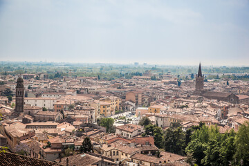 Fototapeta na wymiar Beautiful views of Verona, the Adige river, bridges and cathedrals from the observation deck at St. Peter's castle. Verona, Veneto, Italy