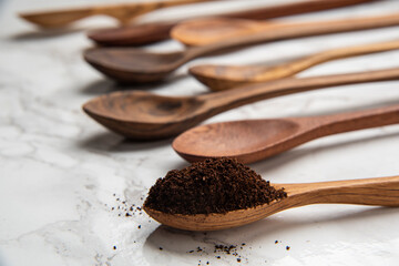 wooden coffee spoons on white marble