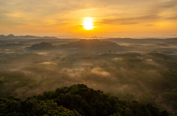 Landscape of beautiful morning fog sunrise in southern of Thailand