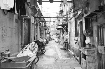 Small alley or street in historic Hutong residential living area in Shanghai or Schanghai in China...