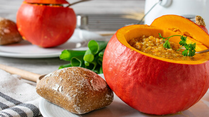 Pumpkin soup served in hollowed pumpkin