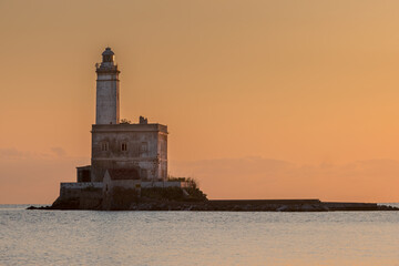 Lighthouse on the island of Mouth, at the entrance to the port of Olbia, Sardinia - Italy