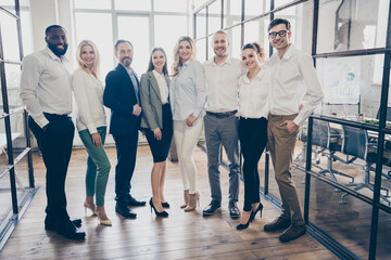 Full body photo of business man lady people eight diversity partners spacious big office successful professionals good mood meet each other after quarantine photographing team indoors