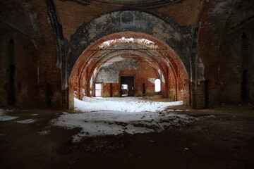 Fototapeta na wymiar abandoned red brick church in winter
