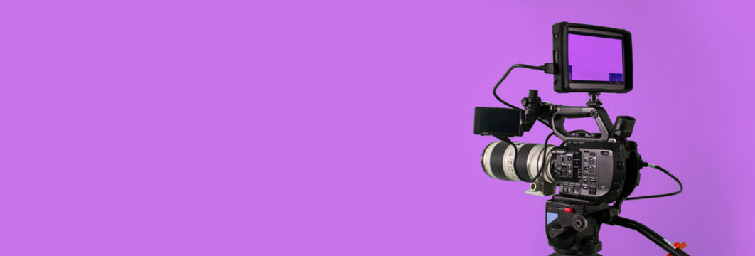 Video camera banner on purple background