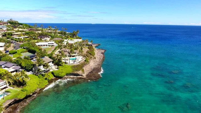 Drone footage of China Walls / Koko Kai Beach Mini Park. Honolulu, Oahu, Hawaii. Maunalua Bay, Pacific ocean. Aerial photography. Koko Head is a tuff cone.  Honolulu Volcanics