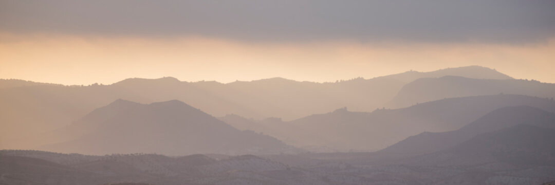 Panorama of sunrise in the mountains.