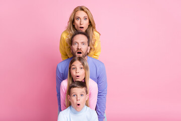 Photo of astonished stack faces mom dad little girl boy look in camera open mouth isolated on...