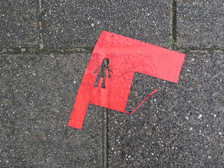 narrow escape, piece of red paper with a cut out figure