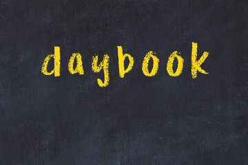 Black chalkboard with inscription daybook on in