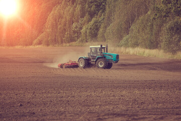 Obraz premium agricultural machines at work in the field