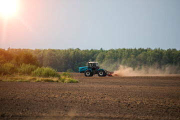 Obraz premium agricultural machines at work in the field