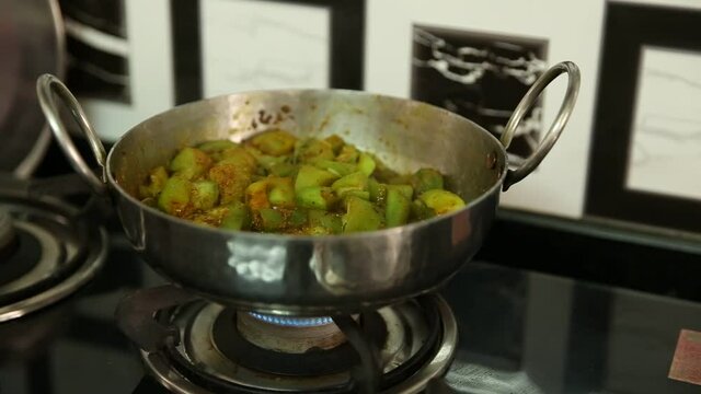 cooking green vegetable known as Sponge Gourd or Ridge Gourd or Snake Gourd which is known as "turai" in hindi and is considered a very tasty and healthy vegetable
