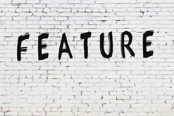 White wall with black paint inscription feature on it