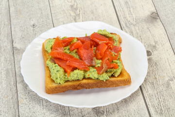 Toast with guacamole and salmon