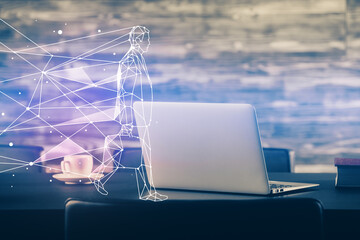 Desktop computer background in office and start up theme hologram drawing. Double exposure. Startup concept.