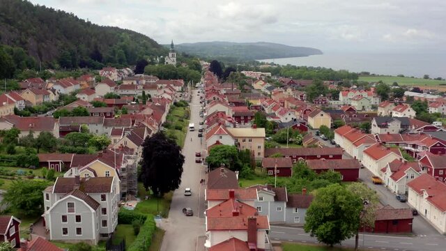 Aerial view of Granna Swedish village at countryside. Drone shot of small town in Sweden known for Polkagris. Lake Vattern in Jonkoping Municipality