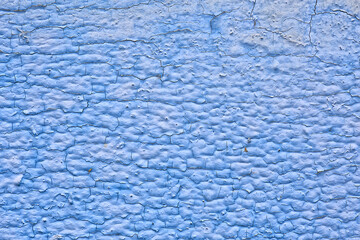 Fototapeta na wymiar blue paint abstract vintage background, wooden old peeling surface