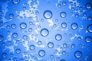 fresh drops background blue glass / wet rainy background, water drops transparent glass blue