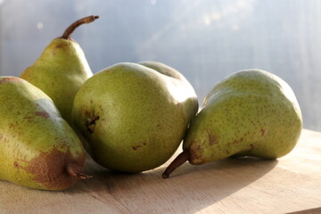 Pears mini on wooden chopping board