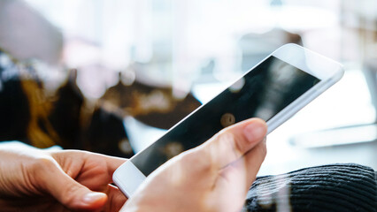 Closeup Image of Women Hand holding a smartphone