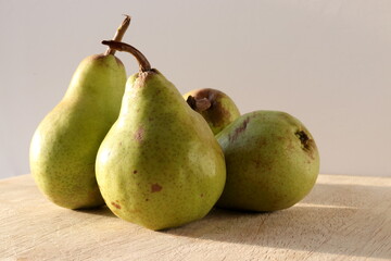 Pears mini on wooden chopping board