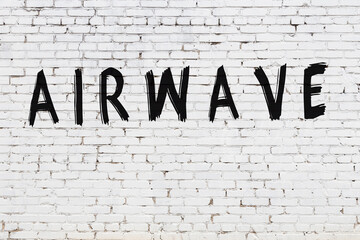 White wall with black paint inscription airwave on it