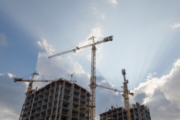 Construction site with cranes on sky background	