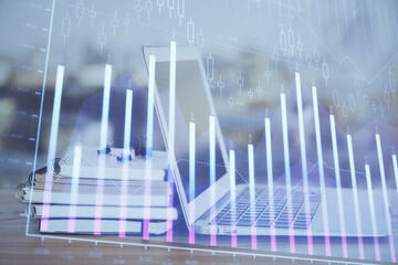 Forex Chart hologram on table with computer background. Double exposure. Concept of financial markets.