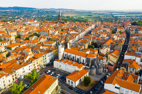 General aerial view of French commune of Riom on summer day, Puy-de-Dome, Auvergne, France