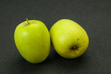 Two ripe green sweet apples