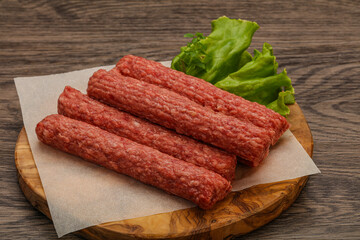 Raw beef sausages with spices