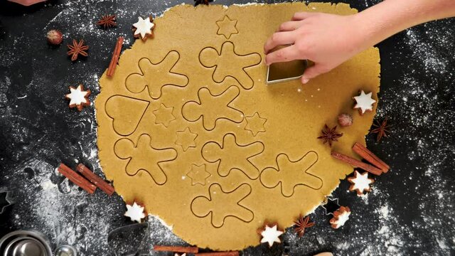 family cooking gingerbread cookies for Christmas