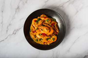 Plate of  Shrimps in curry sauce  
