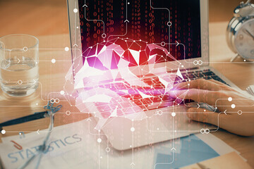 Man typing on keyboard background with brain hologram. Concept of big Data.