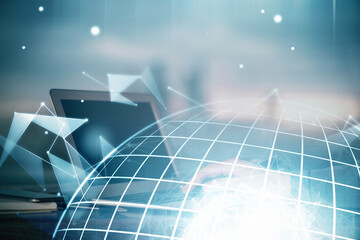 Multi exposure of world map hologram with man working on computer on background. Concept of worldwideweb.