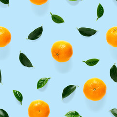 Mandarine seamless pattern, tangerine, clementine isolated on blue background with green leaves. Collection of fine seamless patterns.