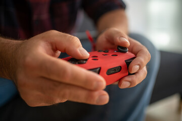 Close up of two hands holding a game controller