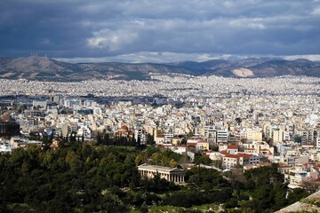 Partial view of Athens city from the Acropolis hill with the temple of Hephaestus in the foreground - Athens, Greece, February 2 2020.