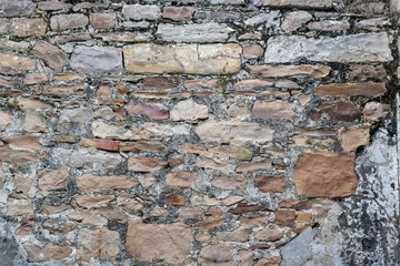 Grunge background stone fortress wall textured.