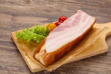 Smoked pork breast with salad leaves