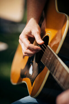 Playing the guitar outside in the sunshine