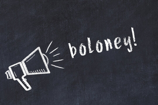 Chalk loudspeaker and inscription boloney on black chalkboard