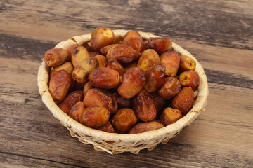 Sweet tasty dry dates in the basket